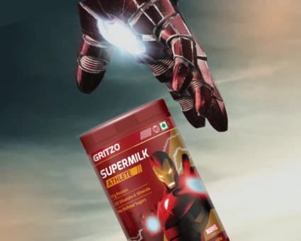 Gritzo Supermilk tub held by a Marvel Iron Man gauntlet